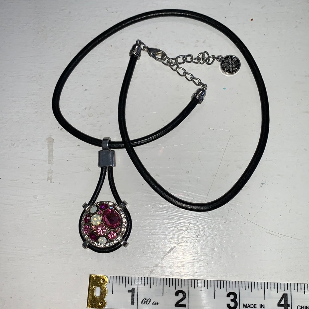 One new 18”+ 2.5” extender black leather cord necklace with pink snap. NWOT
